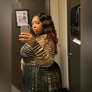 Mesh body suit and leather belt with floor length fringe